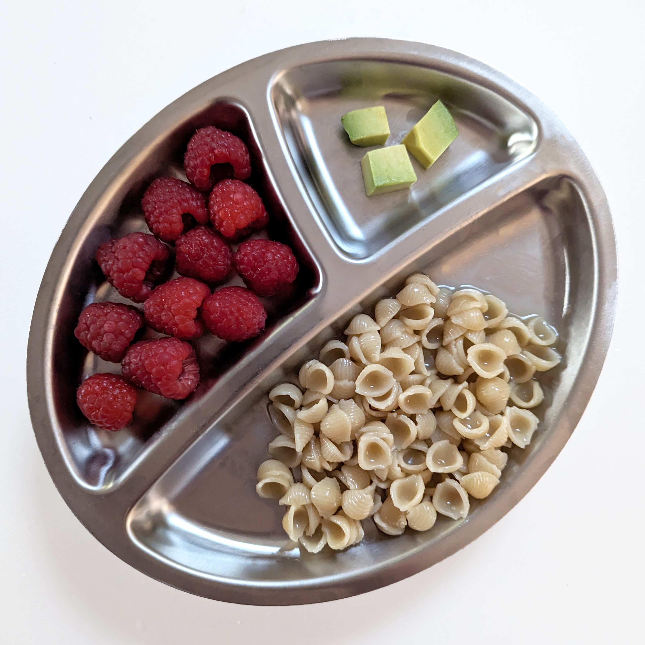 Bone broth pasta, served with raspberries and avocado